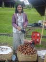Vendor in Basaki selling Snakeskin fruit
